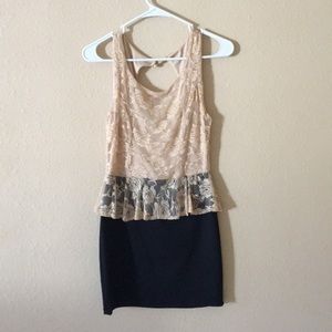 Beige lace and black skirt dress.